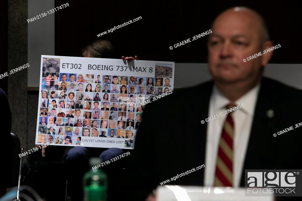 Stock Photo: Michael Stumo holds a sign displaying photographs of the individuals who were killed in the March 10, 2019, crash of Ethiopian Airlines flight 302.