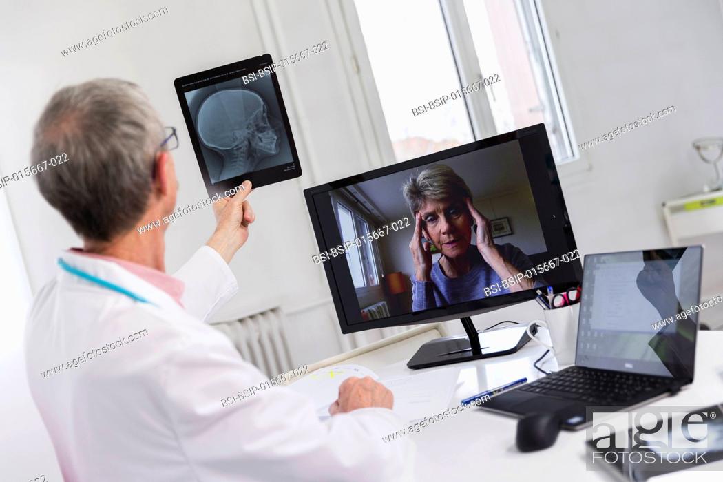 Stock Photo: Medical teleconsultation with senior female patient.