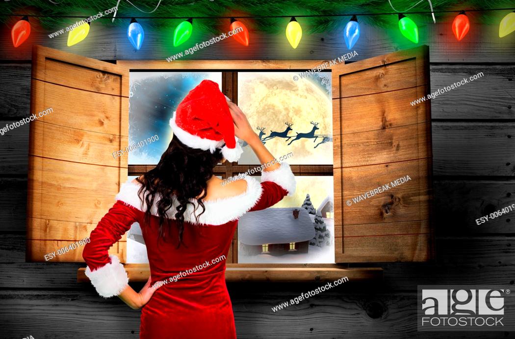 Stock Photo: Composite image of rear view of sexy santa girl.