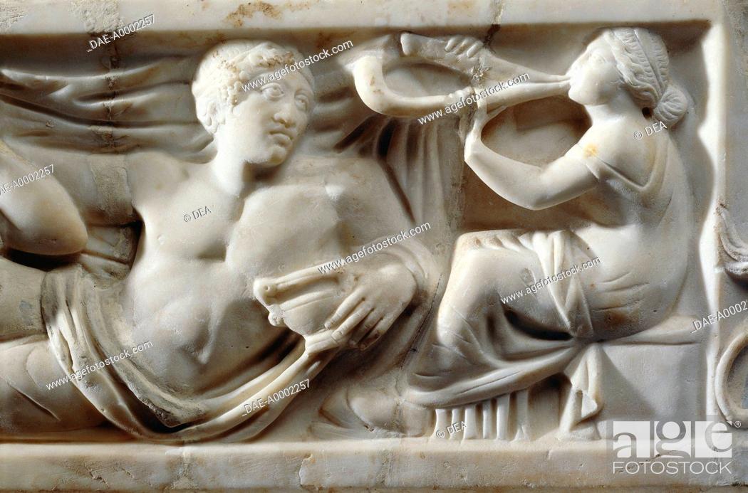 Stock Photo: Roman civilization, 2nd century A.D. Marble sarcophagus with relief depicting the legend of Triptolemus. Detail: musician at a banquet.