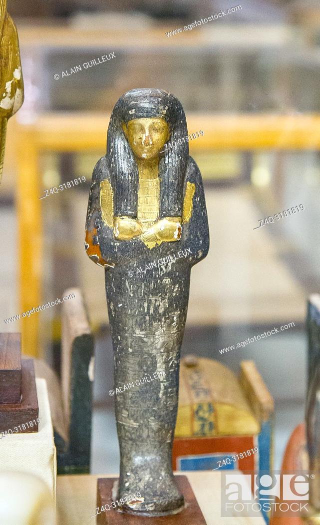 Stock Photo: Egypt, Cairo, Egyptian Museum, from the tomb of Yuya and Thuya in Luxor : Ushebti, in wood covered with silver foils. The face, necklace and hands are gilded.