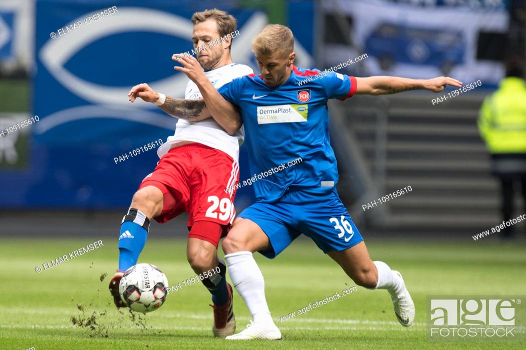 Stock Photo: Matti STEINMANN (l., HH) versus Niklas DORSCH (HDH), Action, duels, Soccer 2. Bundesliga, 5. matchday, Hamburg Hamburg Hamburg (HH) - FC Heidenheim (HDH) 3: 2.