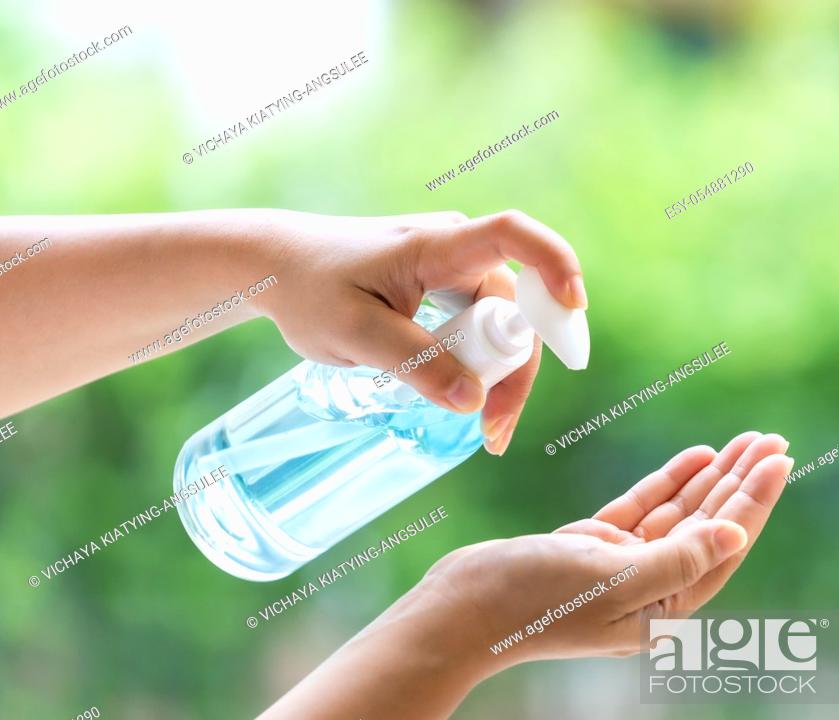 Stock Photo: close-up cleaning hand using alocohol gel hand sanitizer waterless in pump bottle, disinfection for safety prevent and protect from infection of virus and germ.