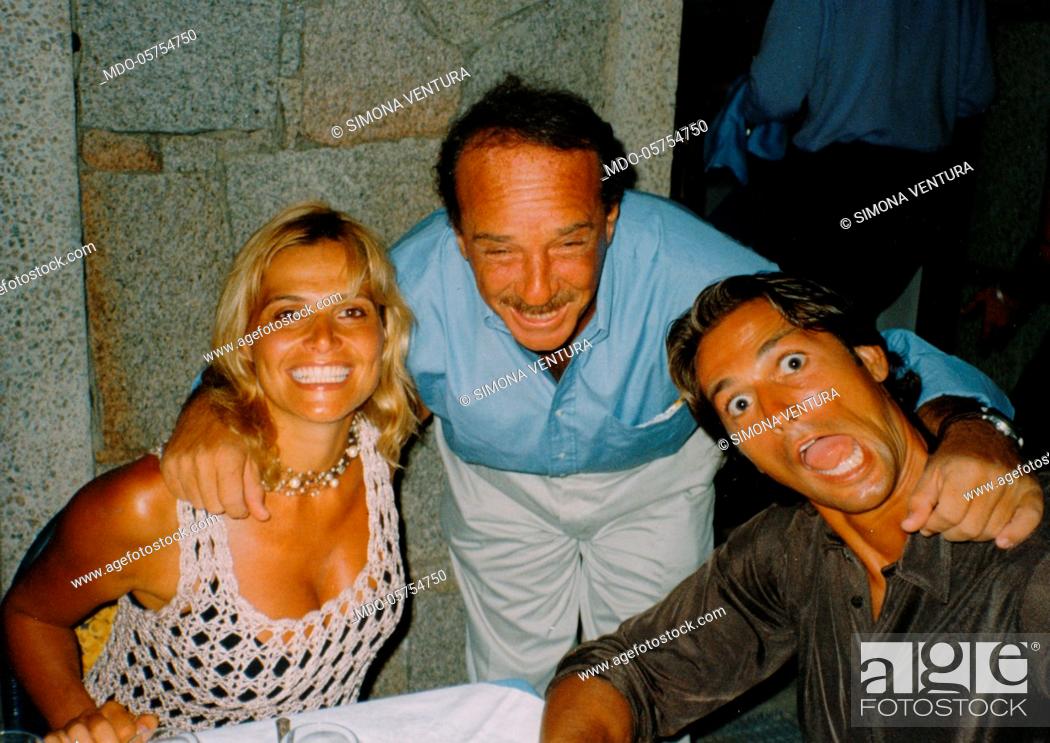 Stock Photo: Italian television presenter and showgirl Simona Ventura posing smiling with her husband, the Italian football player Stefano Bettarini.