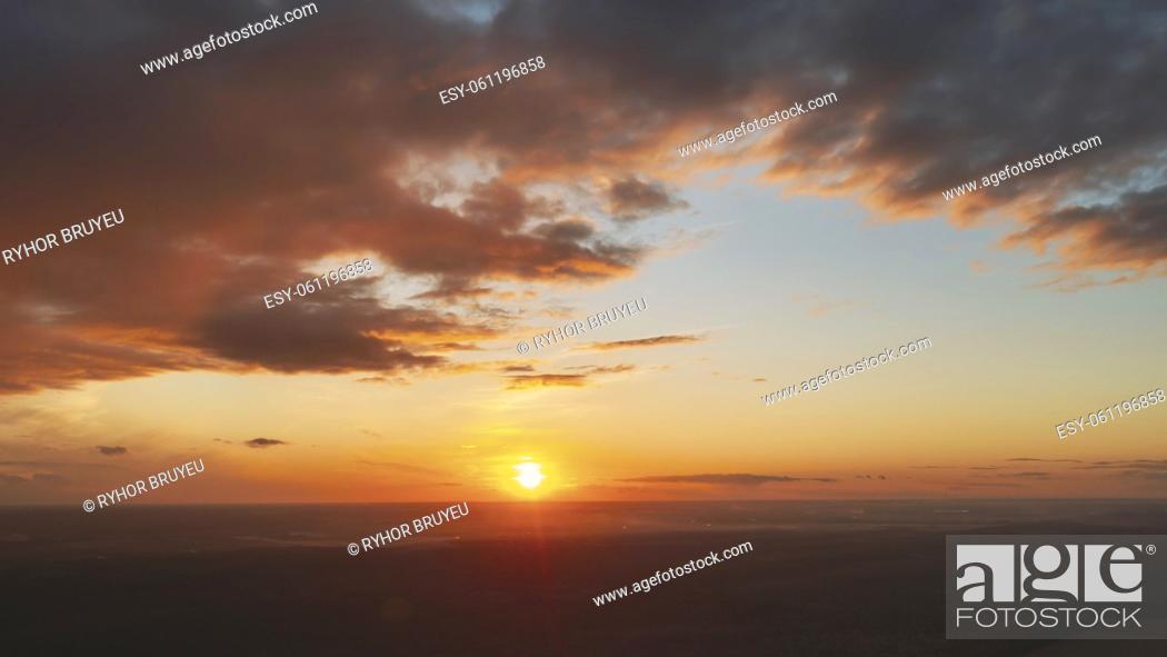 Stock Photo: Aerial View Of Sunshine Bright Dramatic Sky. Scenic Colorful Sky At Dawn. Sunset Sky Above Autumn Field And Meadow, Forest Landscape In Evening.