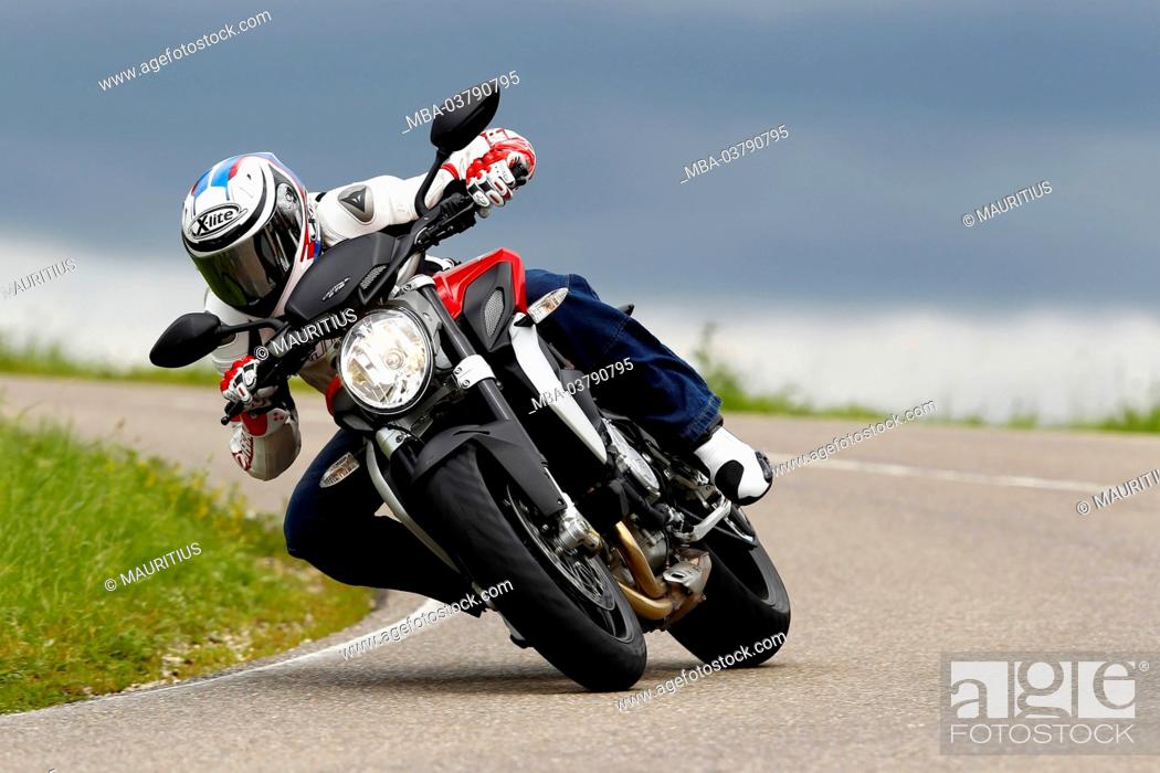 Stock Photo: Motorcycle, MV Agusta Brutale 675 trepistoni, year of construction in 2012, curve picture, country road,.