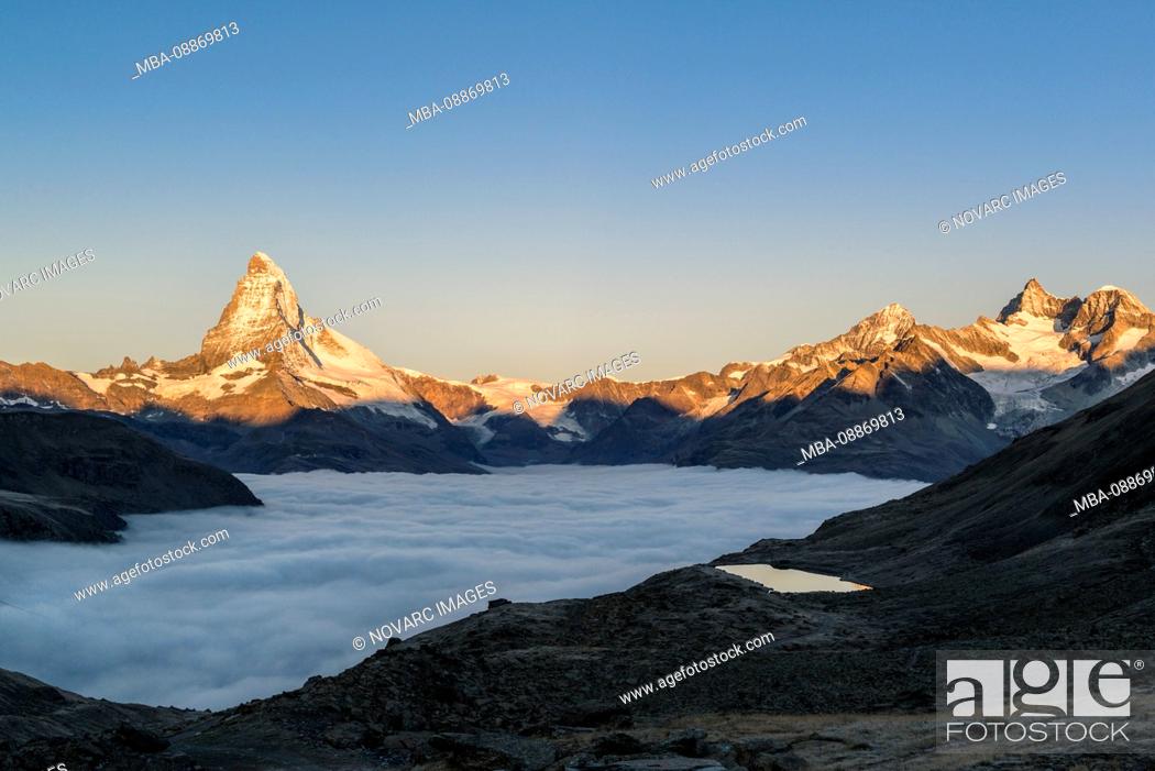 Stock Photo: Matterhorn with clouds at sunrise, Switzerland.