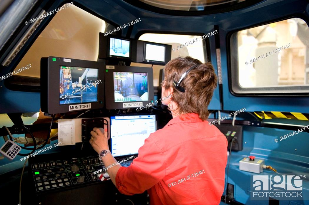 Stock Photo: NASA astronaut Catherine Coleman, Expedition 26 flight engineer, participates in a training session in the Cupola module mock-up in the Multi-use Remote.