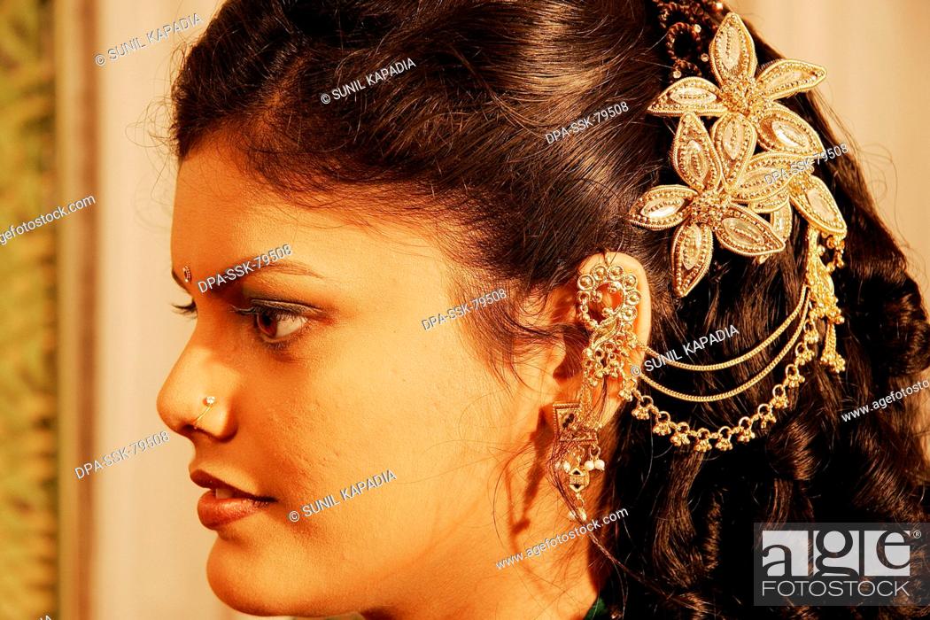 Indian Gujarati girl wearing hair accessory in wedding , India Model  Release 665, Stock Photo, Picture And Rights Managed Image. Pic.  DPA-SSK-79508 | agefotostock