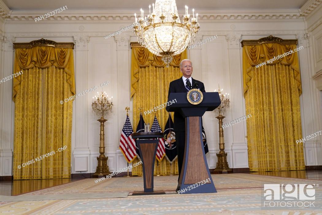 Stock Photo: United States President Joe Biden delivers remarks on the COVID-19 response and the vaccination program in the East Room of the White House in Washington.