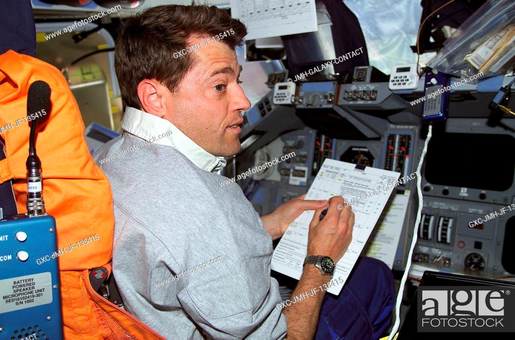 Stock Photo: Astronaut Jeffrey S. Ashby, pilot, temporarily occupies the commander's station for a task on the flight deck of the Space Shuttle Endeavour as the seven-member.