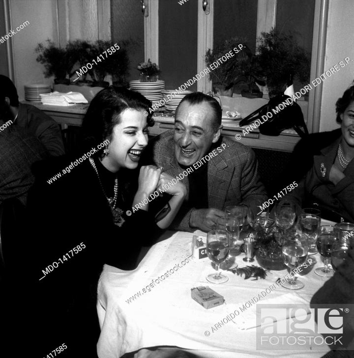 Stock Photo: Totò is enjoying in a restaurant with his daughter and Franca Faldini. The comic actor from Naples Antonio de Curtis, known as Totò.