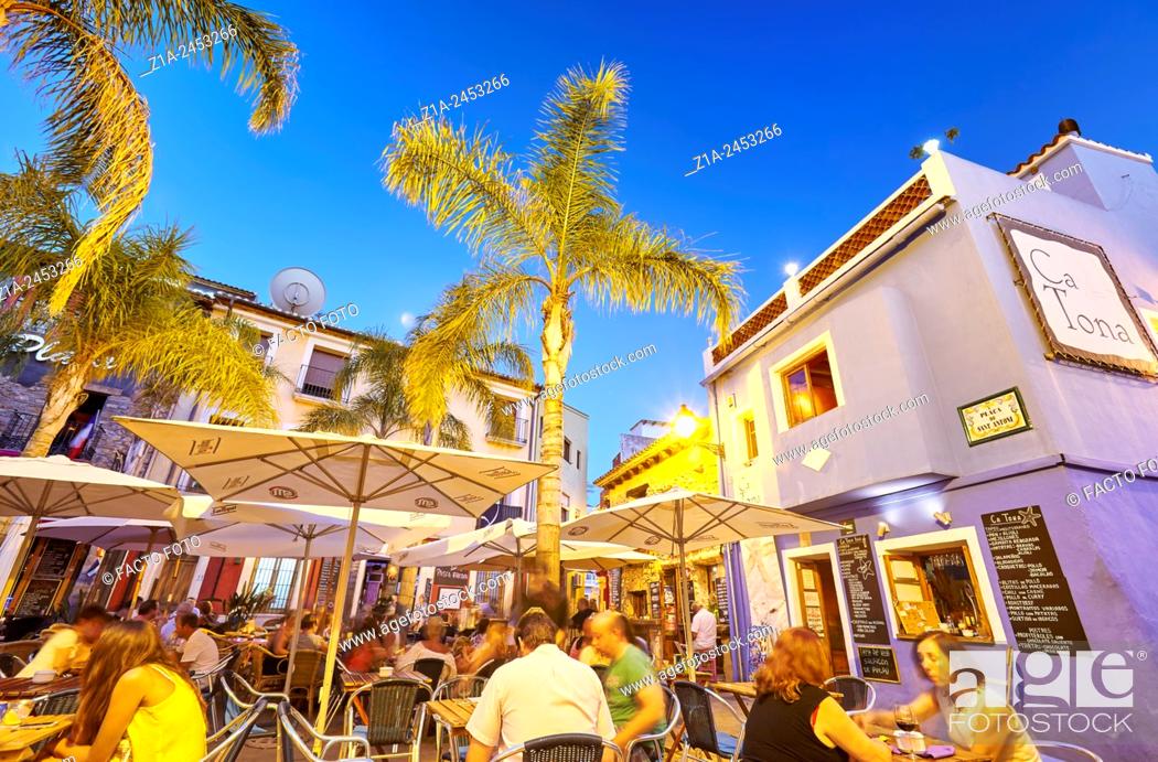 Stock Photo: Restaurant terraces at the Port district by night. Denia. Alicante. Valencia Community. Spain.