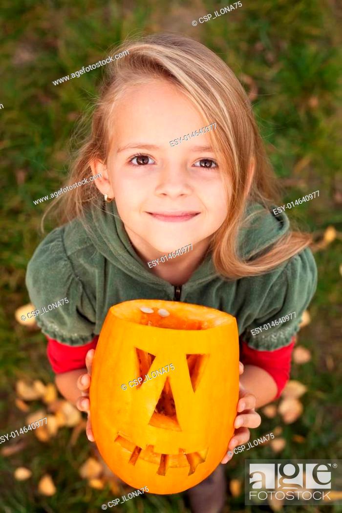 Stock Photo: Autumn portrait with a Halloween pumpkin jack-o-lantern.