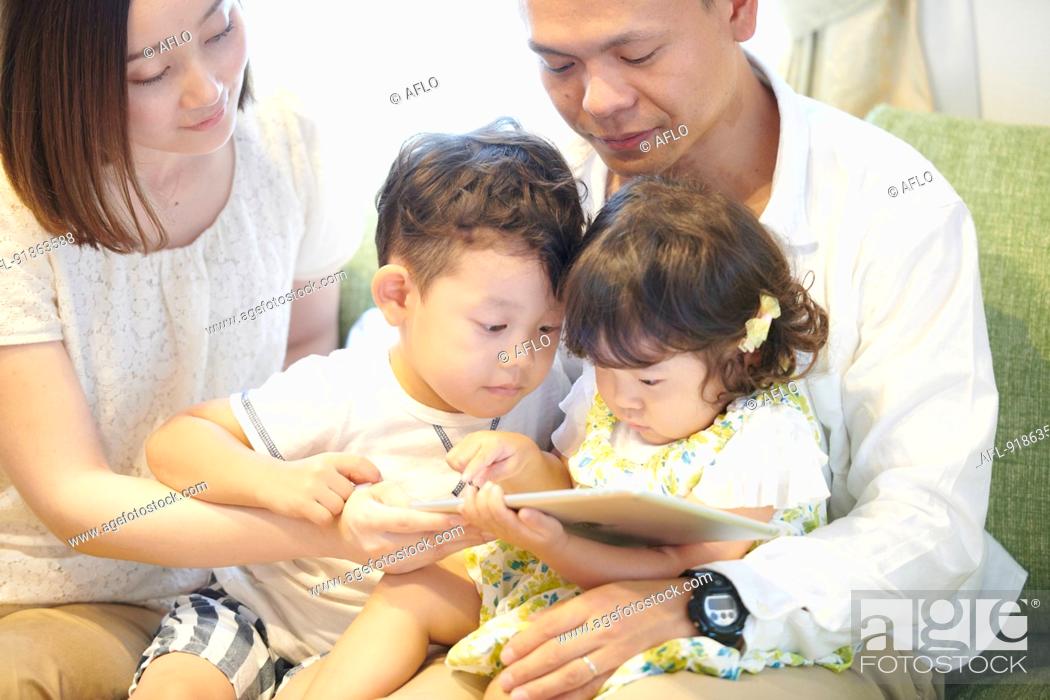 Stock Photo: Japanese family at home.