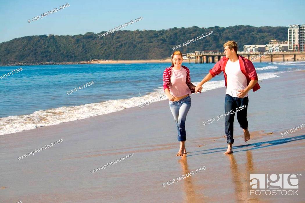 Stock Photo: couple running on beach.