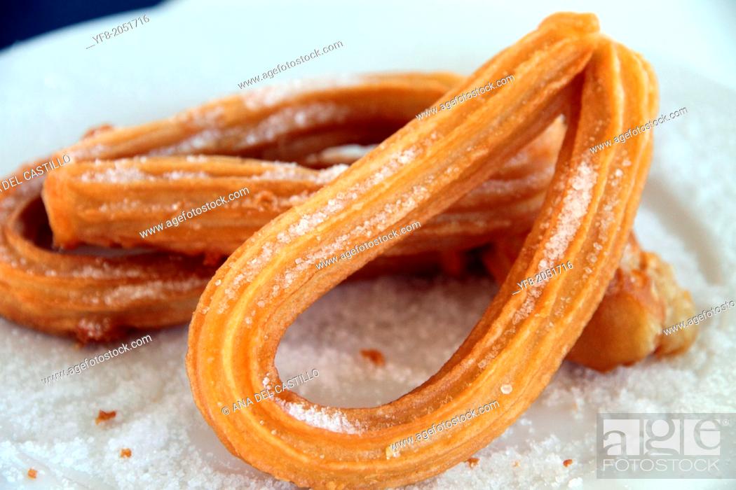 Stock Photo: Churros with sugar on plate.