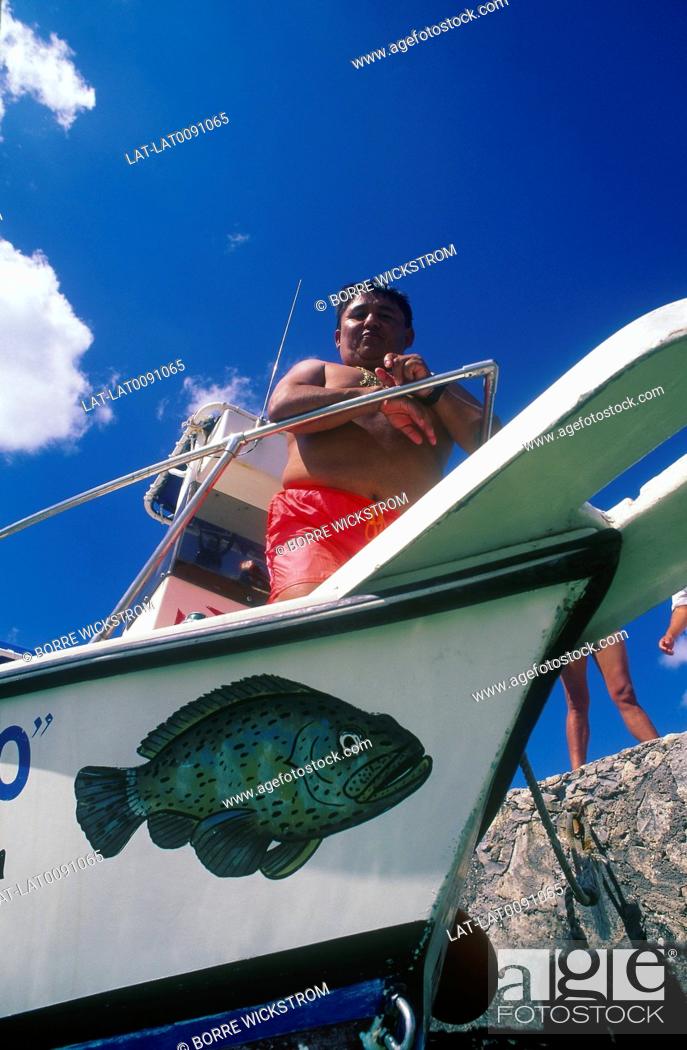 Stock Photo: Scuba diving. Boat. Dive master. Standing on prow of boat.