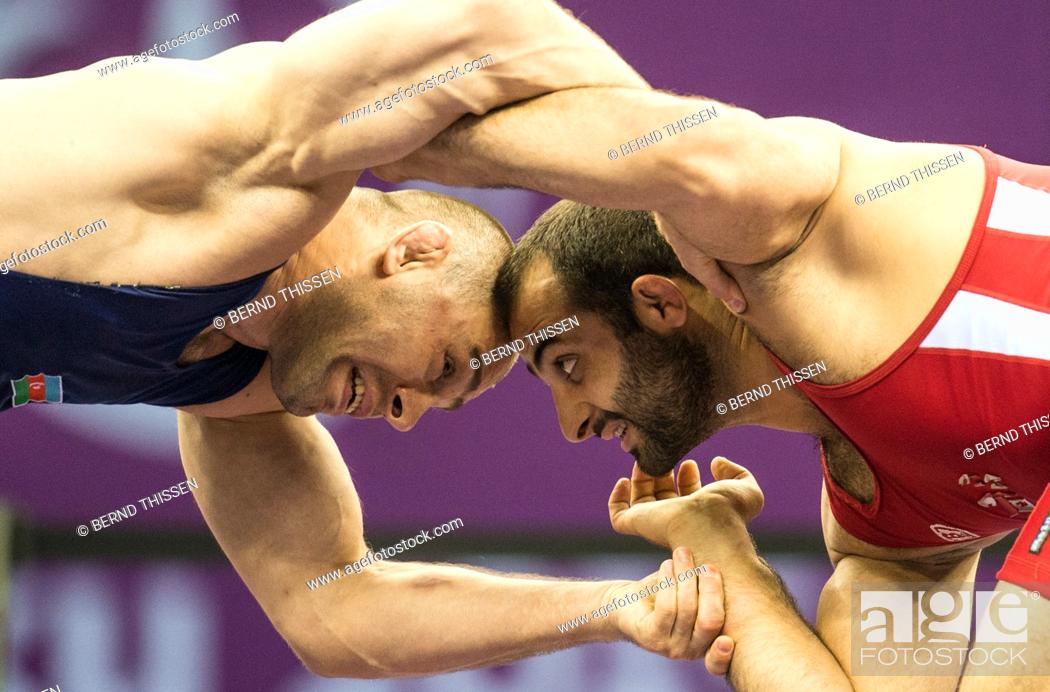 Stock Photo: Georgias Elizbar Odikadze (red) competes with Khetag Gazyumov of Asherbaijan (blue) in the wrestling Men's 97kg Freestyle Final at the Baku 2015 European Games.