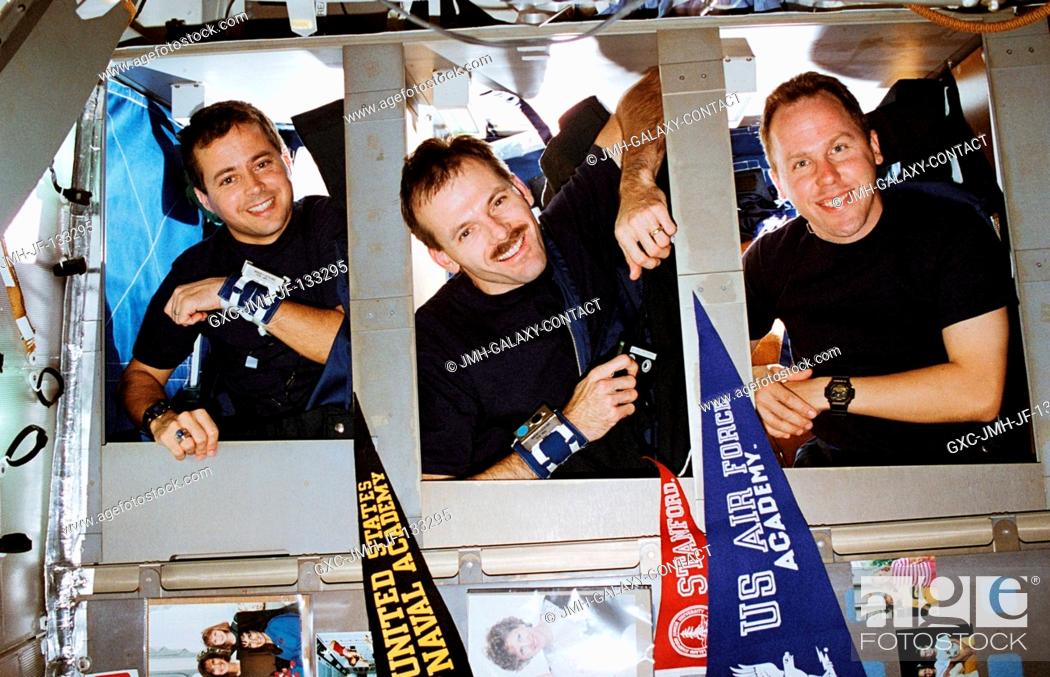 Stock Photo: The STS-68 blue shift team members were photographed prior to sleep time in bunk beds aboard the Space Shuttle Endeavour.