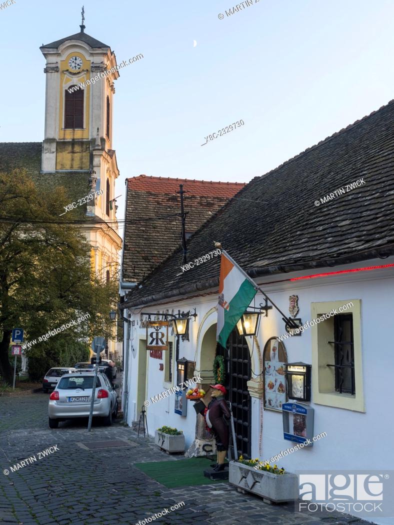 Stock Photo: Szentendre near Budapest, a historic small town on the banks of the Danube. Sunset over in the old town with the catholic church of Peter and Paul.