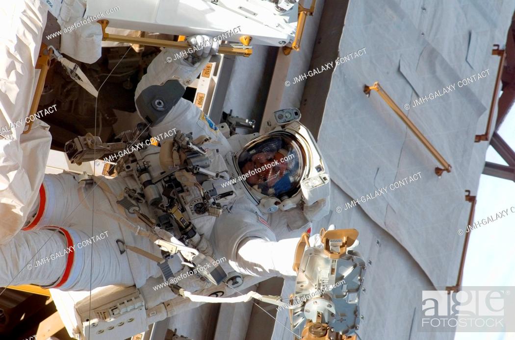 Stock Photo: Astronaut Rick Linnehan, STS-123 mission specialist, participates in the mission's first scheduled session of extravehicular activity (EVA) as construction and.