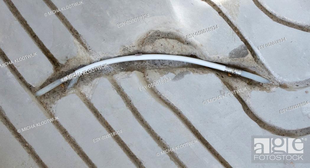 Stock Photo: Milling in concrete floor - Preparation for underfloor heating.