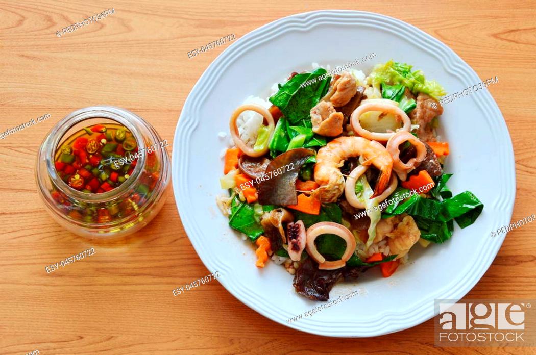 Stock Photo: stir fried mixed vegetable with seafood and chili fish sauce.