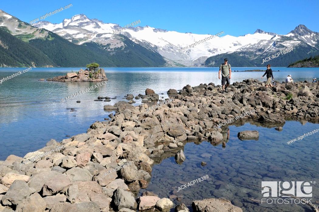 Stock Photo: Couple hiking by Garibaldi Lake, Garibaldi Provincial Park, British Columbia, Canada.