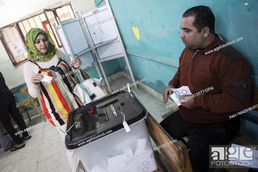 Stock Photo: 22 April 2019, Egypt, Cairo: A woman casts her ballot on the third and last day of the national referendum on the constitutional amendments extending the.