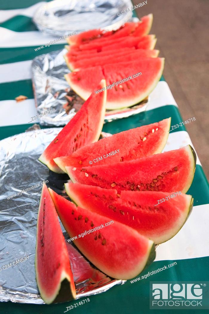 Stock Photo: Watermelone slices selling by vendors at the open-air market in Forodhani Gardens, Stone Town, Unguja Island, Zanzibar Archipelago, Tanzania, East Africa.