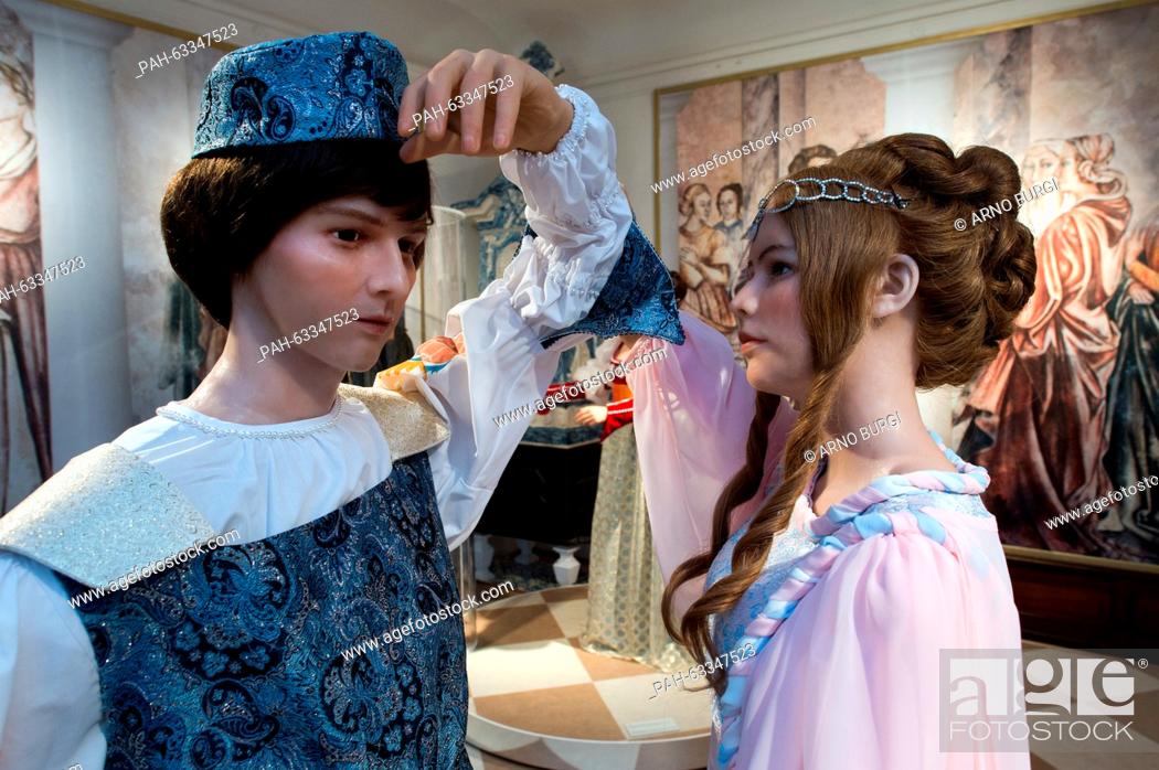 Stock Photo: Two wax figures depicting Cinderella (R) and the prince are on display at the exhibition 'Three hazelnuts for Cinderella' at Moritzburg palace in Moritzburg.