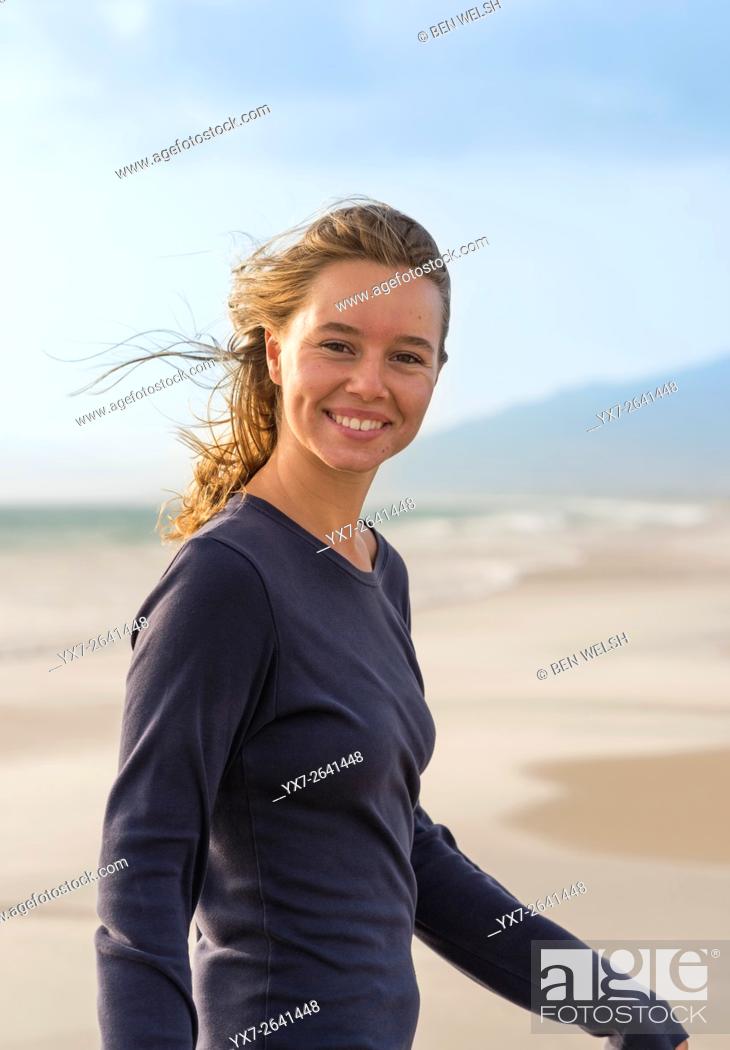 Stock Photo: Young blond teenager at the beach.
