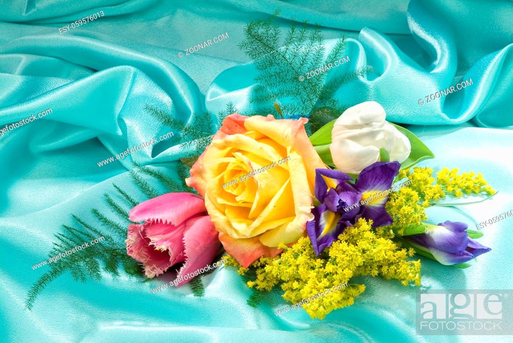 Stock Photo: Still life with bouquet of flowers and accessories on a studio background.