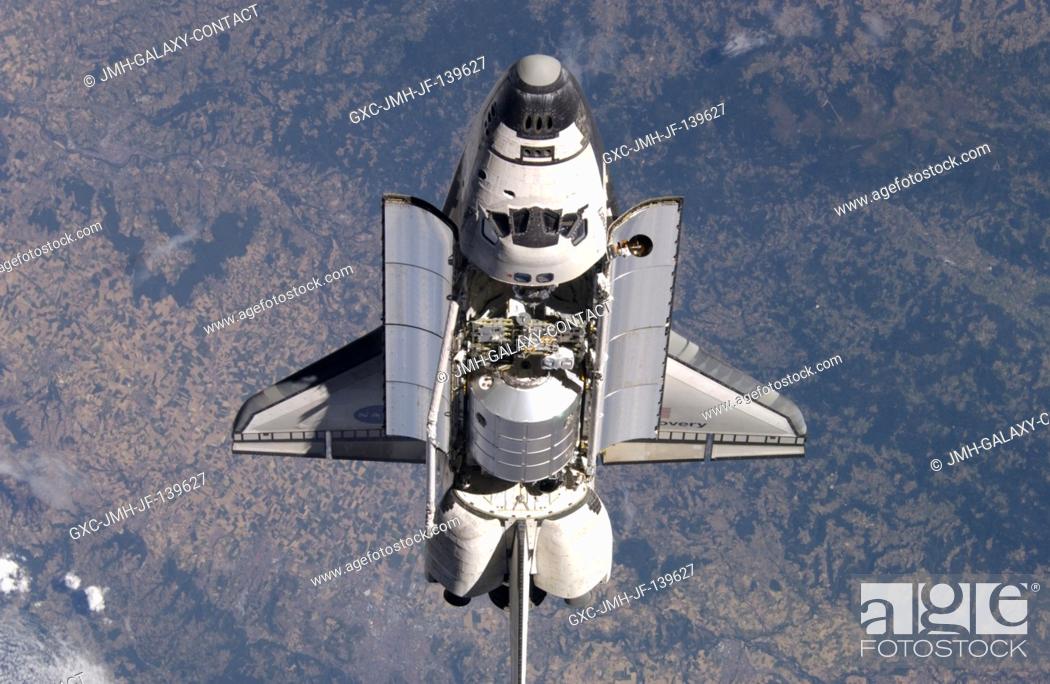 Stock Photo: Space Shuttle Discovery was about 600 feet from the International Space Station when cosmonaut Sergei K. Krikalev, Expedition 11 commander, and astronaut John L.