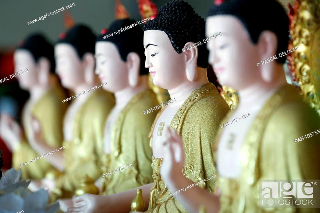 Stock Photo: Hoi Tuong Te Nguoi Hoa buddist chinese temple. Row of buddha statues. Phu Quoc. Vietnam. | usage worldwide. - Duong Dong/Phu Quoc/Vietnam.