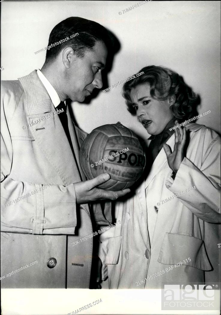 Stock Photo: Aug. 08, 1957 - A bomb in a football balloon: Jeanne Moreau seems frightened: Paul Meurisse and Jeanne Moreau are the principal characters of the film 'Ecehoau.