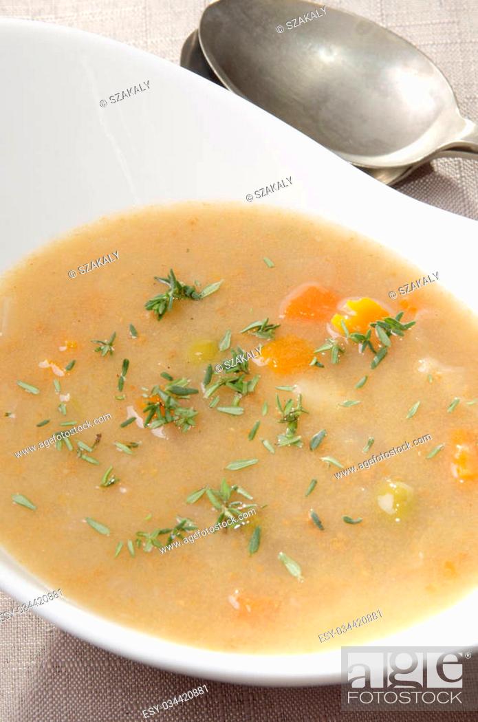 Stock Photo: scotch broth soup with carrots and fresh thyme.