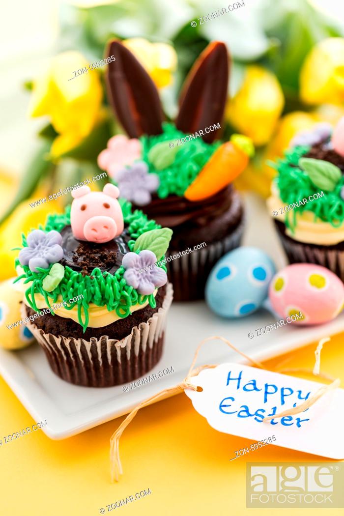 Stock Photo: Easter chocolate cupcakes decorated with piggy and bunny ears.