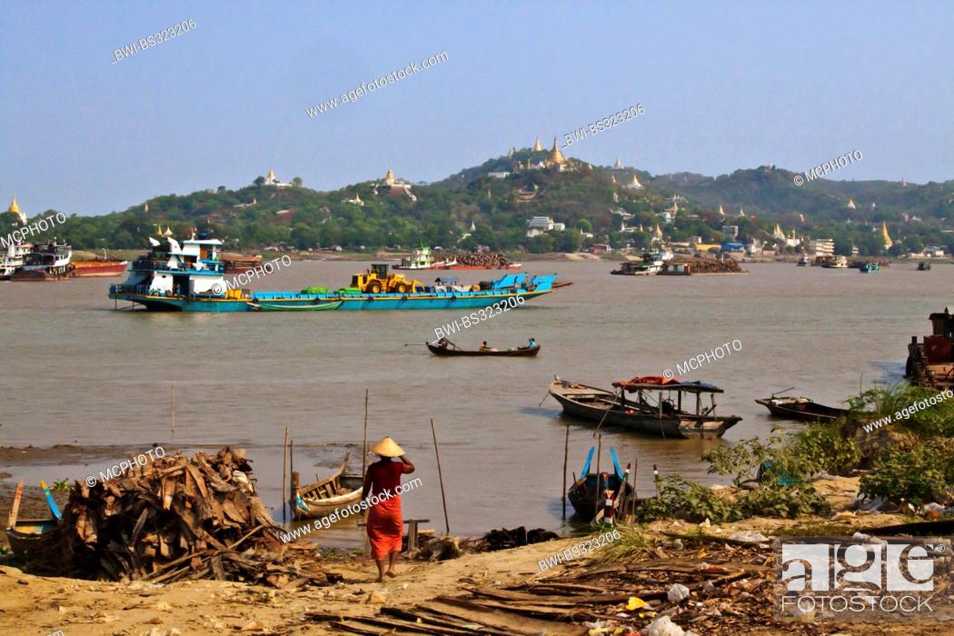 Stock Photo: boat traffic on the Irrawaddy River with Sagaing hill behind, Burma, Mandalay.