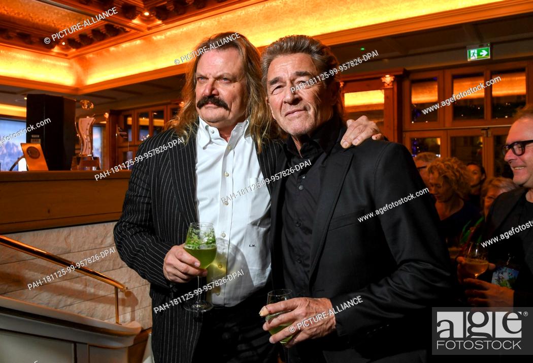 Stock Photo: 25 November 2018, Bavaria, München: Leslie Mandoki (l), music producer and Peter Maffay, musicians come to the Aftershowparty after the film premiere of.