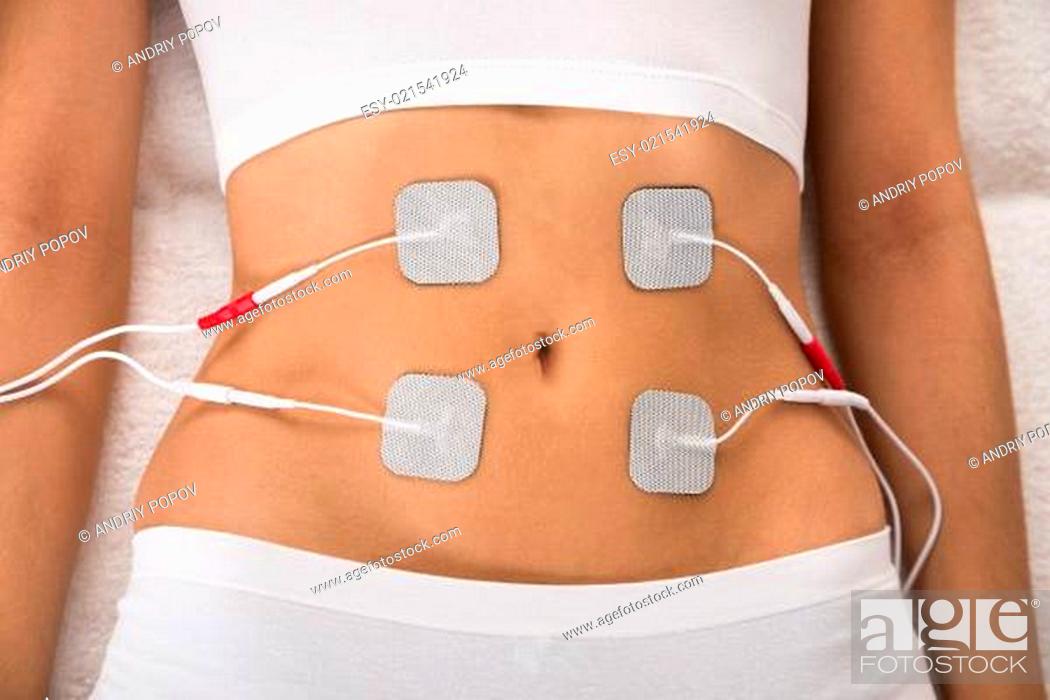 Stock Photo: High Angle View Of A Woman With Electrodes On Her Stomach.