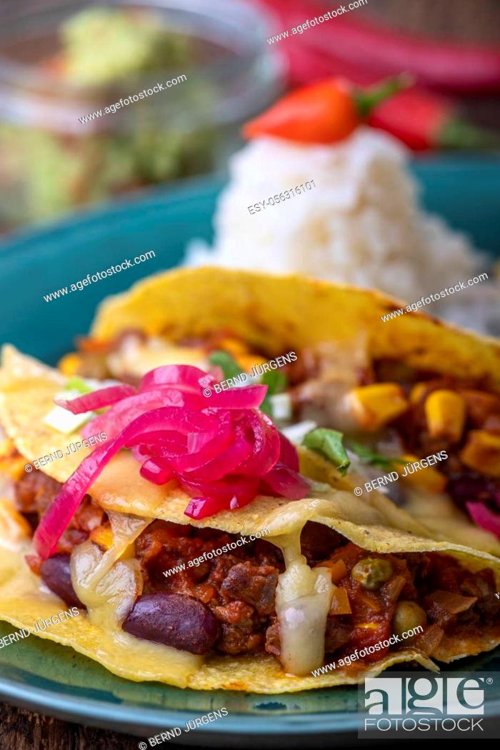 Stock Photo: mexican tacos with rice on wood.
