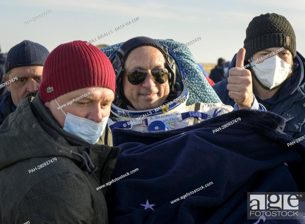 Stock Photo: Expedition 66 Russian cosmonaut Anton Shkaplerov is carried to a medical tent shortly after he and fellow crew mates Mark Vande Hei of NASA and Pyotr Dubrov of.