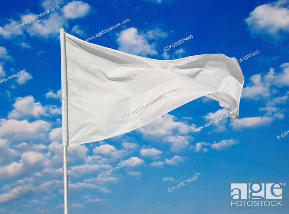 Stock Photo: White flag against a blue sky with clouds fluttering in the wind.