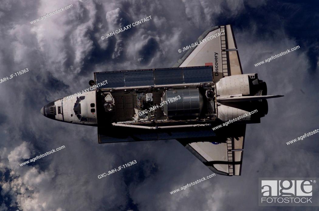 Stock Photo: Overall view of the Space Shuttle Discovery as photographed during the survey operations performed by the Expedition 11 crew on the International Space Station.