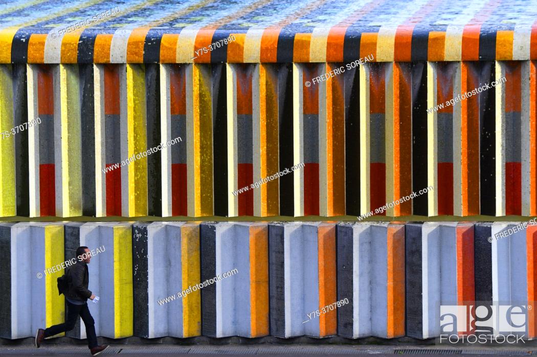 Stock Photo: Wall of fountain covered in mosaic tiles by Israeli artist Yaacov Agam, in the La Defense area in Paris, France.