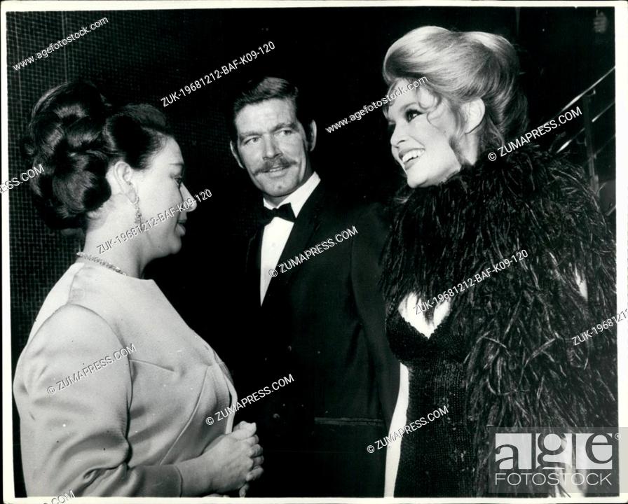 Stock Photo: Dec. 12, 1968 - Princess and Brigitte converse in French. Princess Margaret talking in French with Brigitte Bardot, in center, Stephen Boyd.