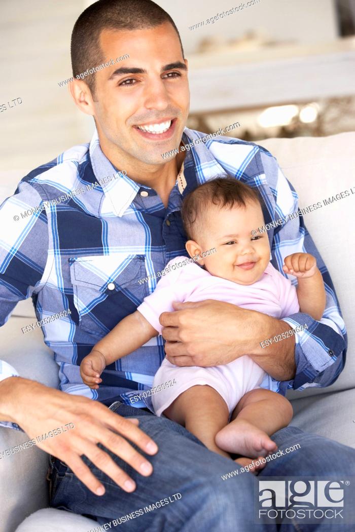 Stock Photo: Young Father On Sofa At Home.