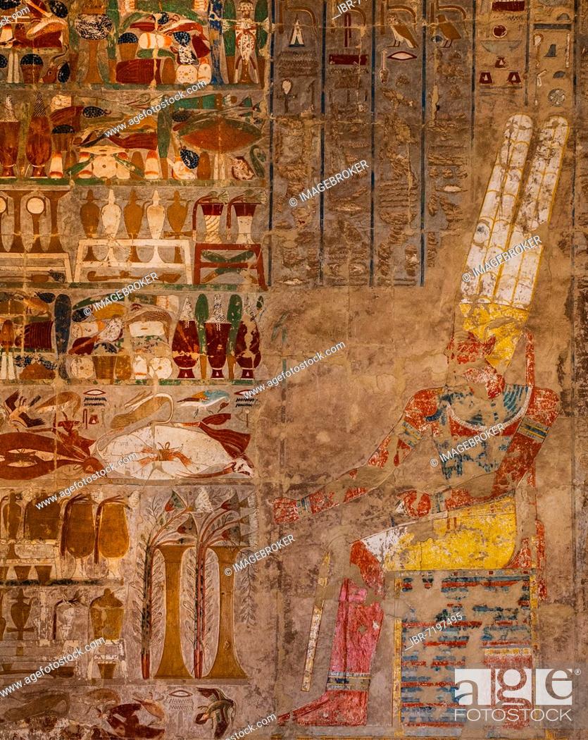 Stock Photo: Hall of columns in the Anubis Chapel: Amun is sitting on his throne in front of the offerings which Hatshepsut (destroyed) has piled up up in front of him.
